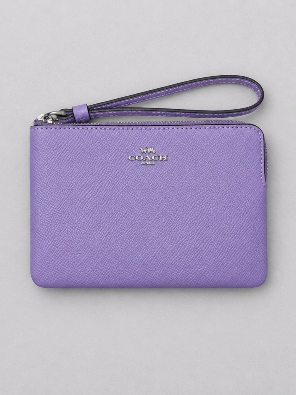 COACH Corner Zip Wristlet crafted in purple crossgrain leather NWOT